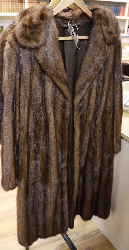 A brown full length mink coat